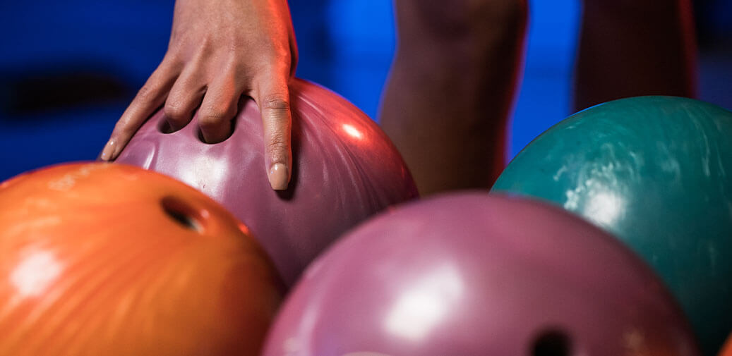 Weekly Specials banner featuring man picking up a bowling ball