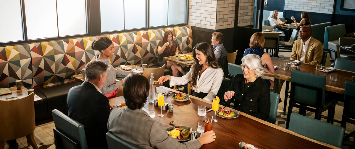 A group of friends enjoying a meal at The Salt Stone restaurant