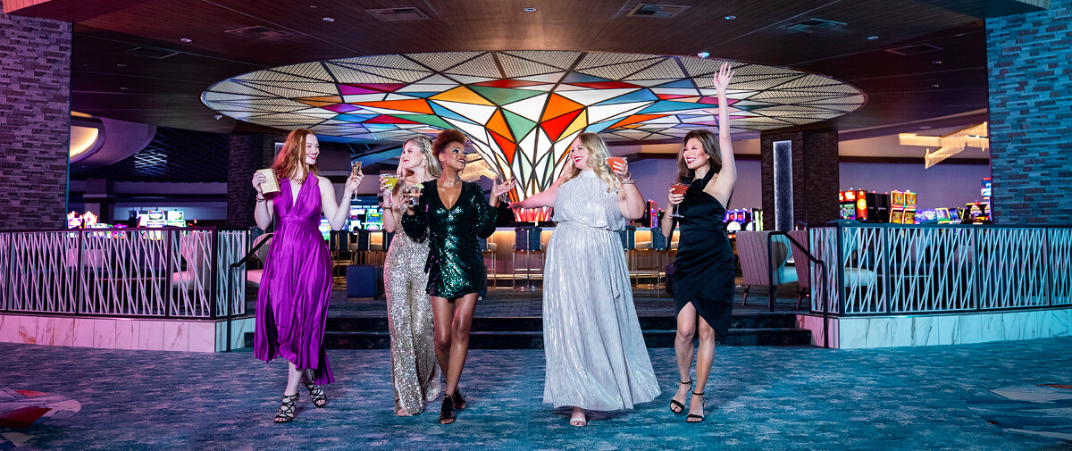 Four Women laughing at the Prizm Lounge