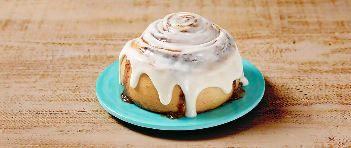 Cinnabon cinnamon roll on plate