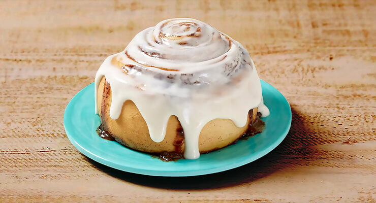 Cinnabon cinnamon roll on plate
