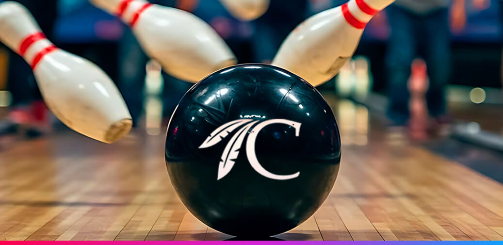Choctaw-branded bowling ball in front of white bowling pins.